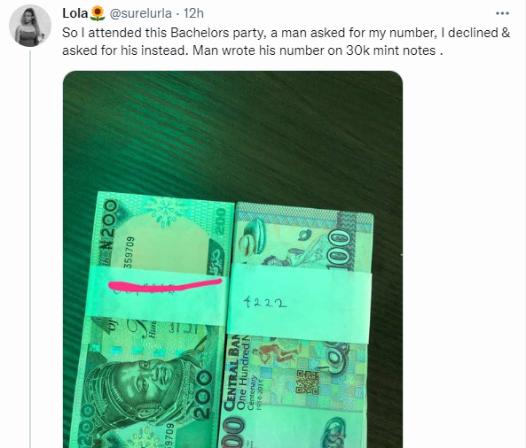 Nigerian woman posts a picture of the bundles of Naira notes that a Nigerian man sent her after she refused to give him her phone number.